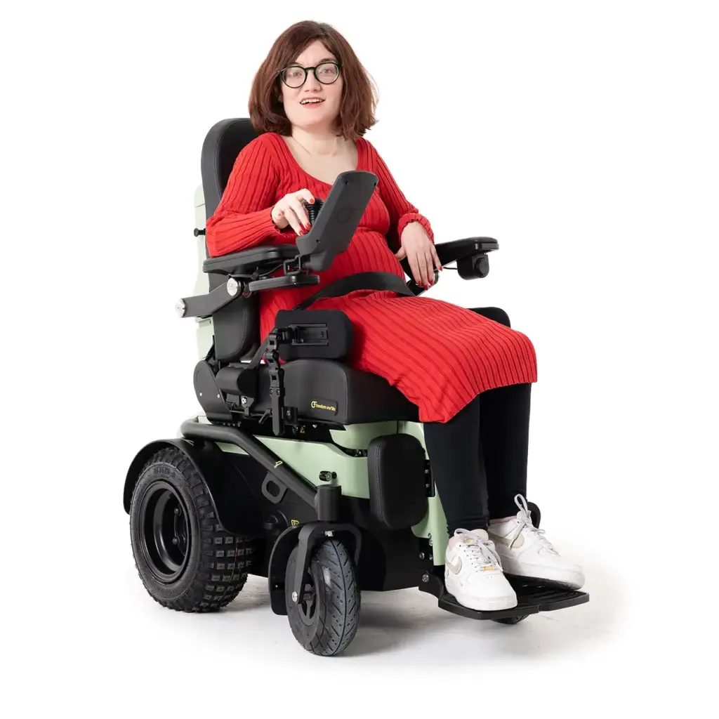series-5-powerchair-smiling-woman-with-glasses-red-dress