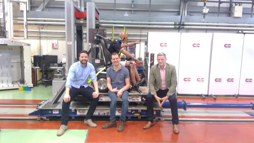 A photo of the Freedom One Life Team sitting on front of their passed Crash Test