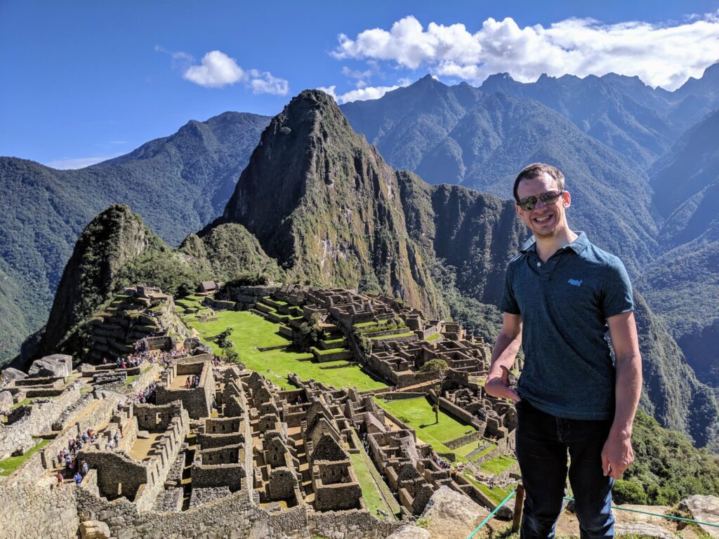 Alex standing at the top of Machu Picchu
